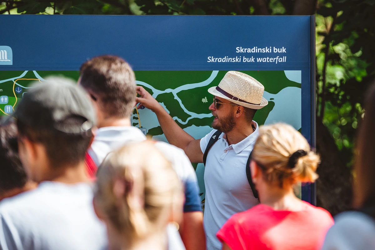 Group of tourists with a guide at the entrance to Krka National Park